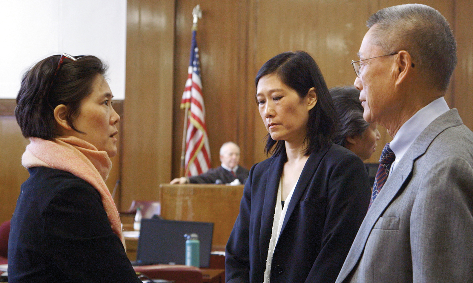 After a three-month trial, from left, Jill, Vera, and Thomas Sung await the verdict in the State Supreme Court in Manhattan.