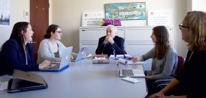 Attorney John J. Barter with the BC Innocence team, from left, Sarah Carlow '20, Emily Smith '20, Rachel Feit '20, and Sharon Beckman.