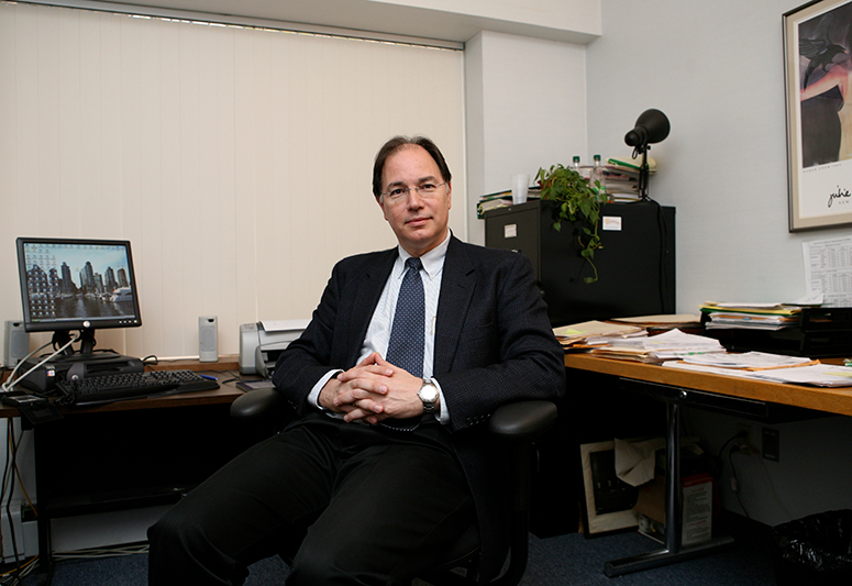 Alan Minuskin seated in an office
