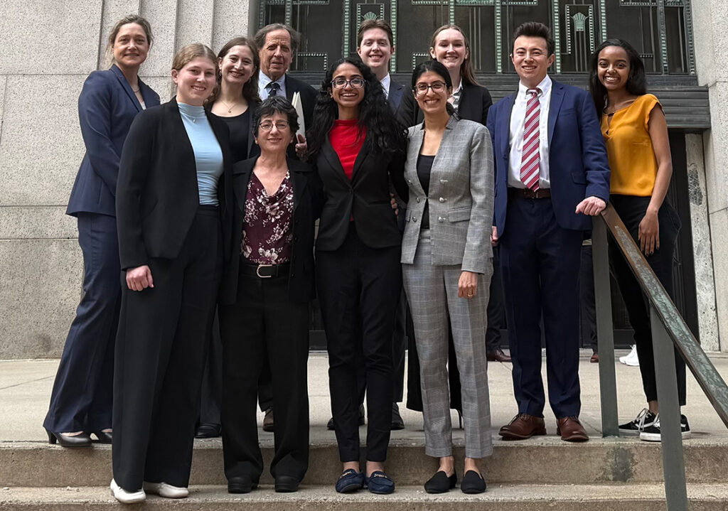 Civil Rights Clinic Professor Reena Parikh, (in gray suit) with her team of students and legal colleagues.