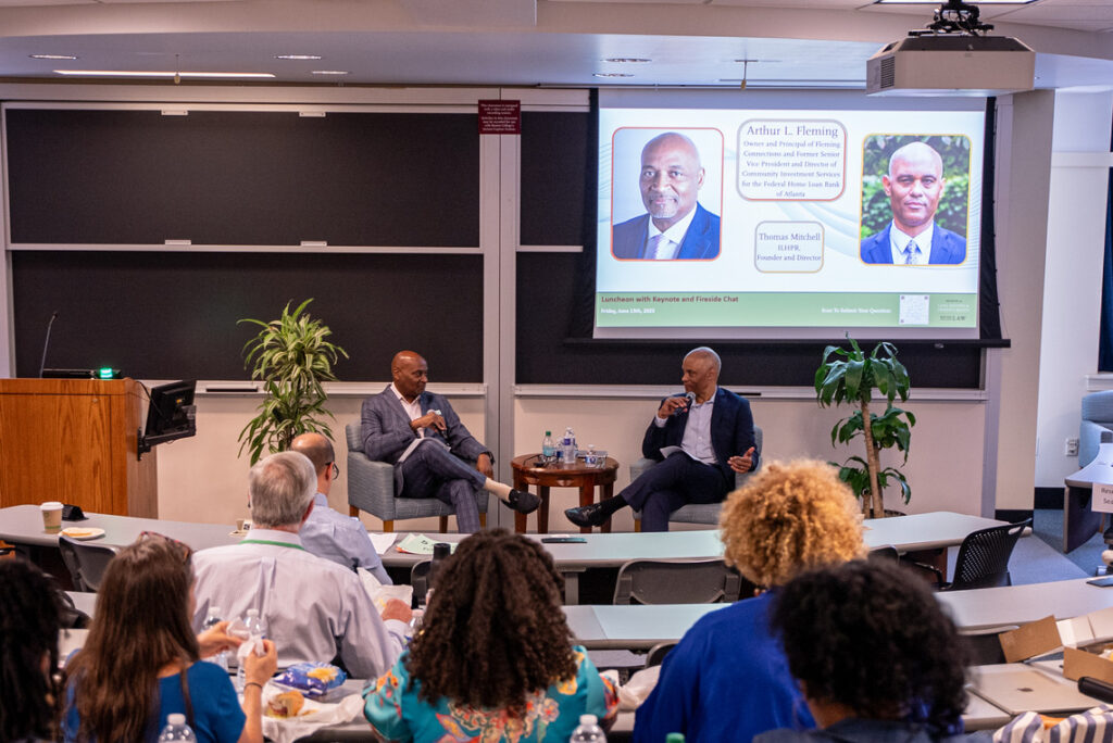 Arthur Fleming (L) and Prof. Thomas Mitchell during their fireside chat