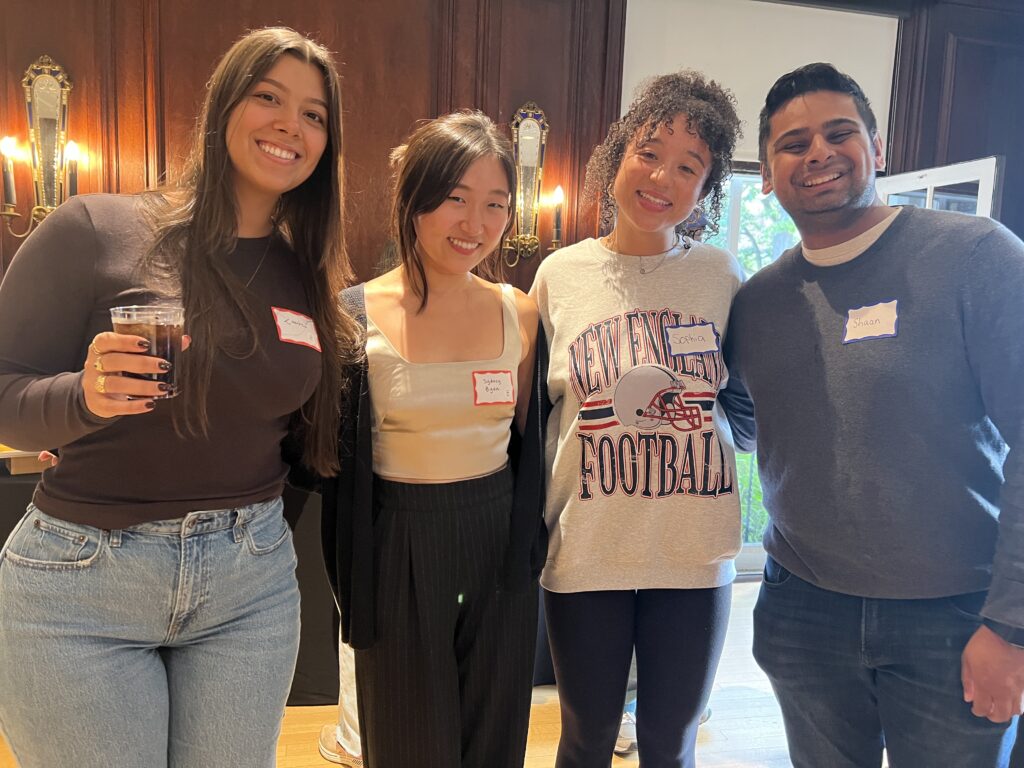 four students smiling