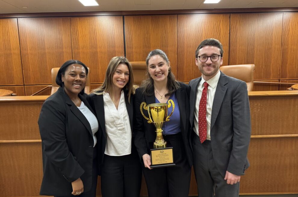 mock trial team 2025 at quinnipiac holding 1st place trophy
